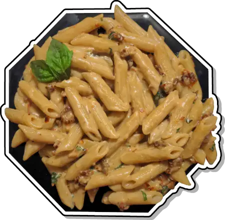 Penne pasta coated in a creamy mozzarella sauce with sun-dried tomatoes and fresh basil.